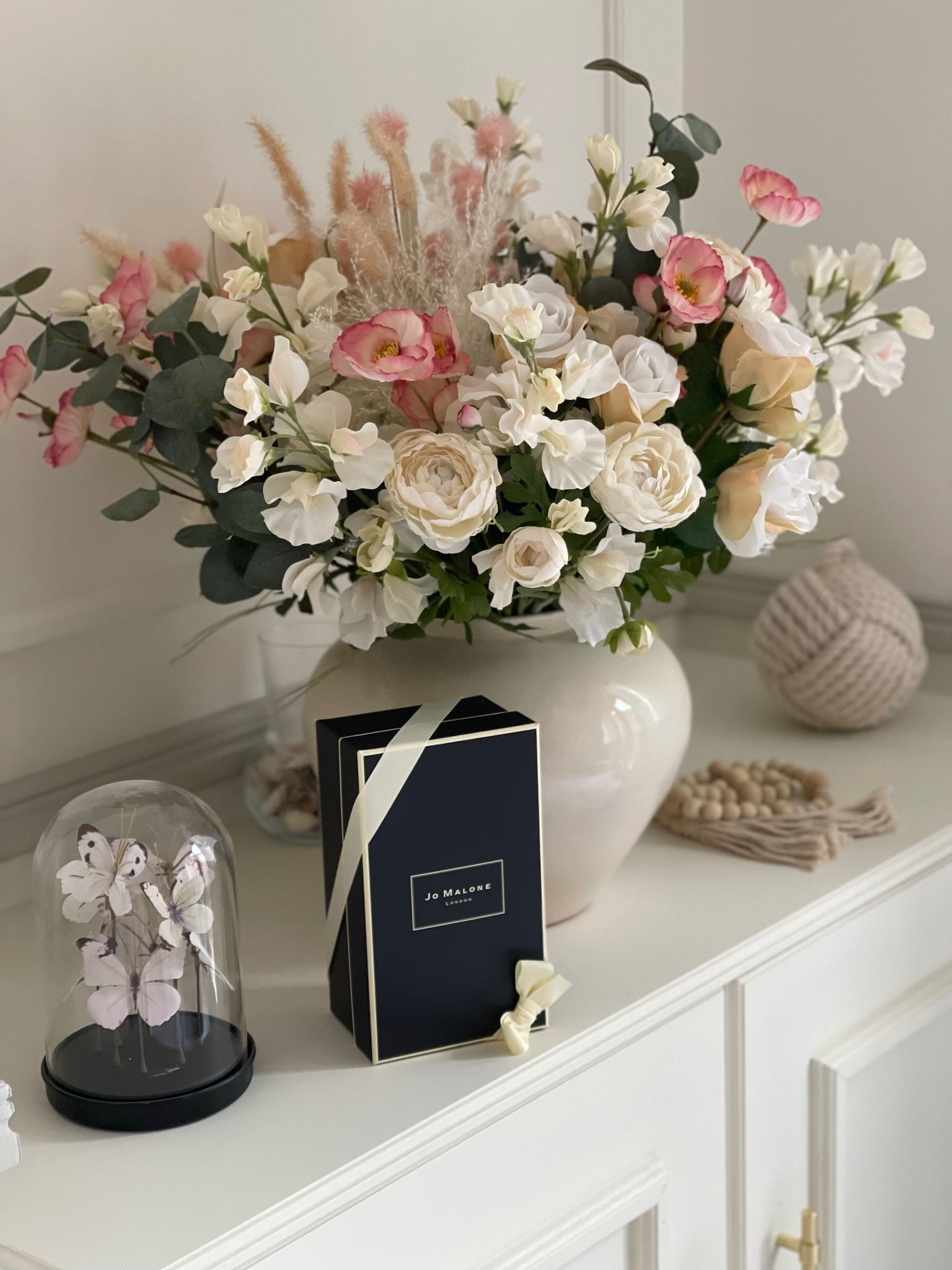Interior styling by Maison Zohora — beautifully curated sideboard with florals, objects and considered arrangement